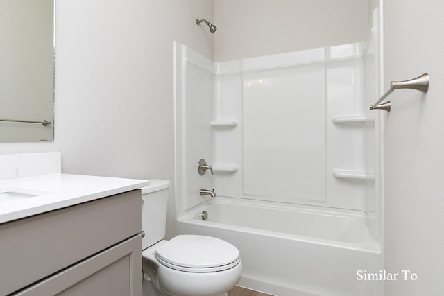 full bathroom featuring bathing tub / shower combination, vanity, and toilet