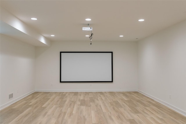 home theater with light hardwood / wood-style floors