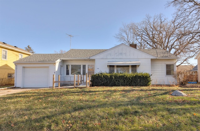 ranch-style house with a garage and a front yard