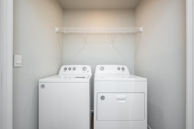 laundry area with washing machine and dryer