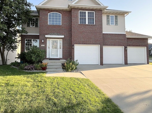 view of front of home with a front yard and a garage