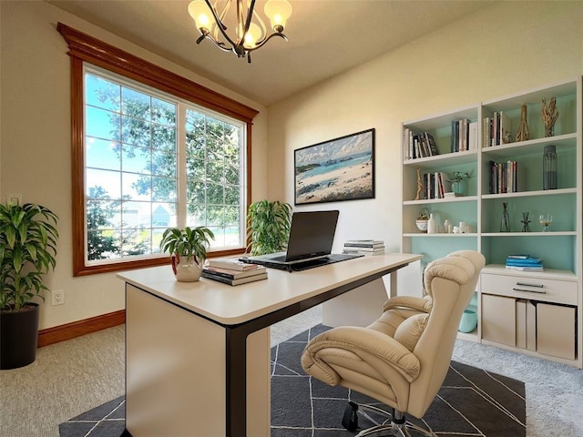 carpeted office with a chandelier