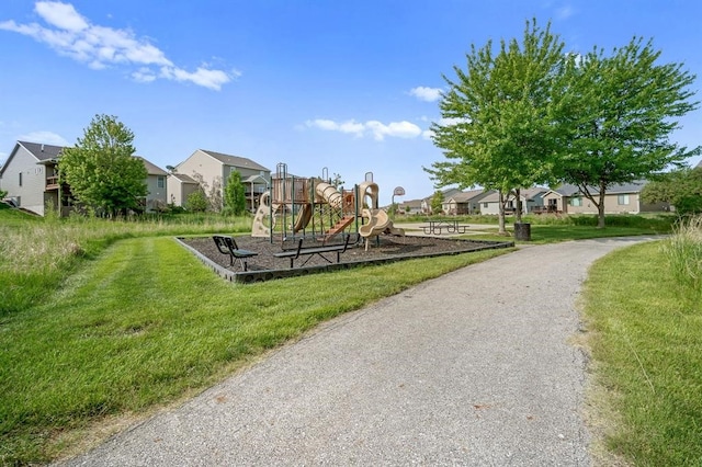 view of community with a playground and a yard