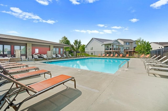 view of swimming pool with a patio area