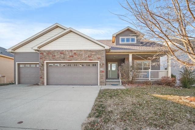 craftsman-style house with a porch and a garage