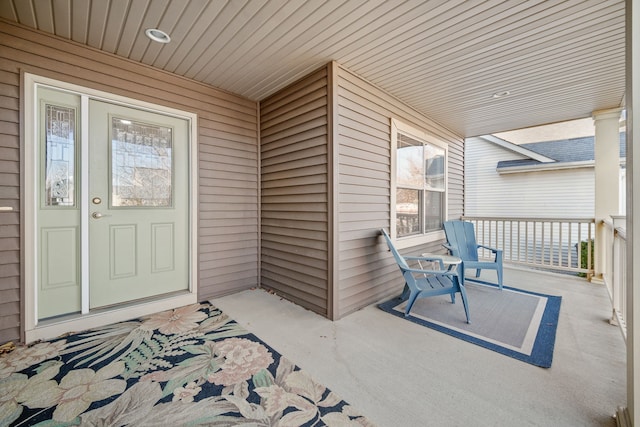 view of exterior entry featuring a porch