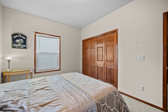 carpeted bedroom featuring a closet