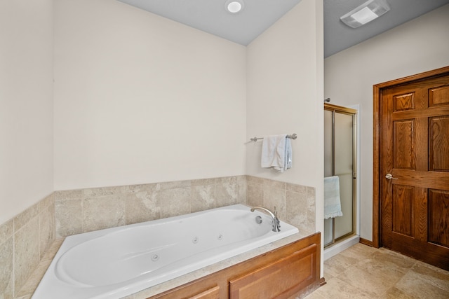 bathroom with tile patterned floors and plus walk in shower