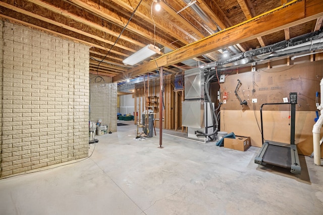 basement with heating unit and brick wall