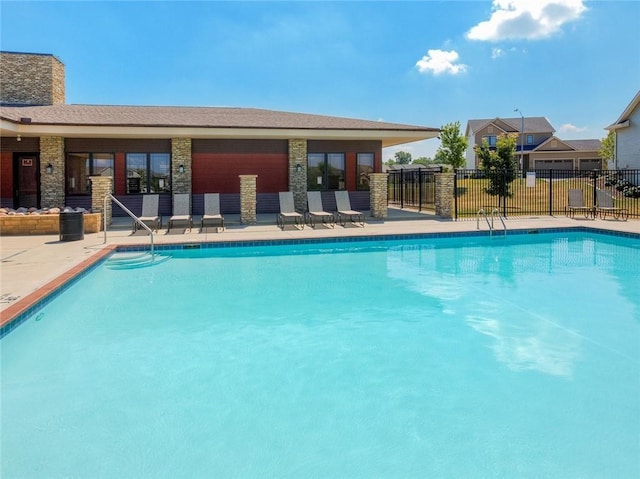 view of swimming pool with a patio area