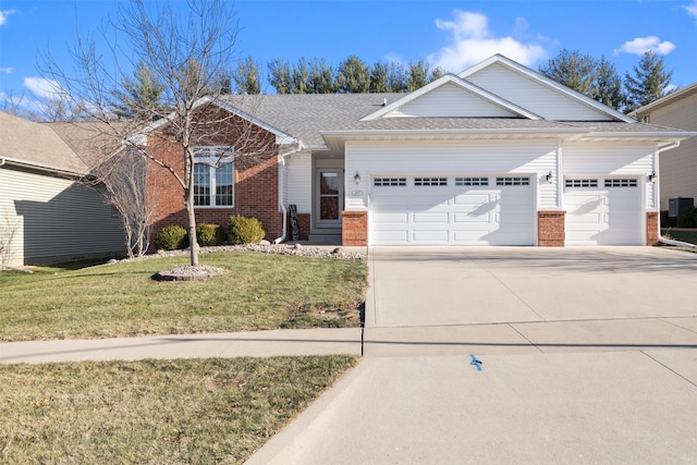 view of front facade featuring a garage and a front lawn