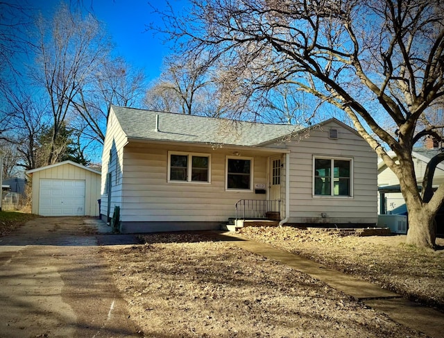 view of front of home with an outbuilding and a garage