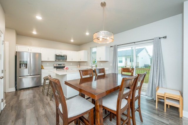 dining area featuring dark hardwood / wood-style floors