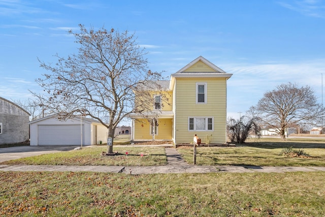 view of front facade featuring a front lawn, an outdoor structure, and a garage