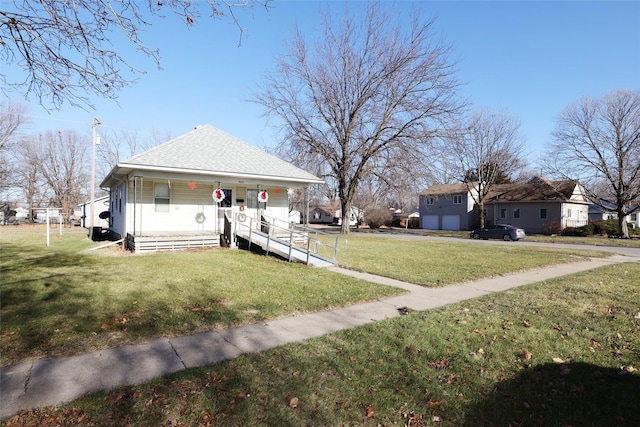 view of front facade featuring a front lawn and covered porch