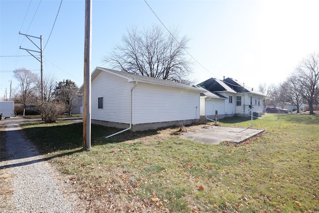 view of home's exterior featuring a yard