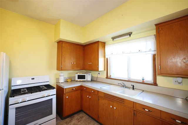 kitchen with sink and white appliances