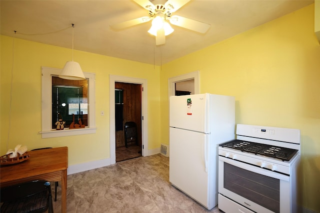 kitchen with pendant lighting, white appliances, and ceiling fan