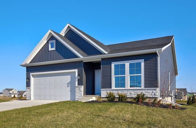 view of front of home featuring central AC, a garage, and a front lawn