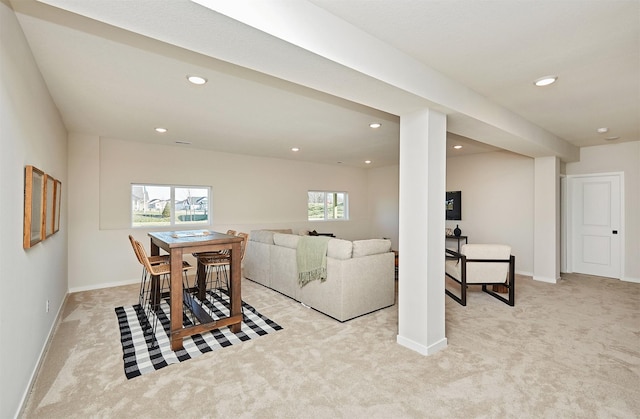 living room featuring light colored carpet and a wealth of natural light