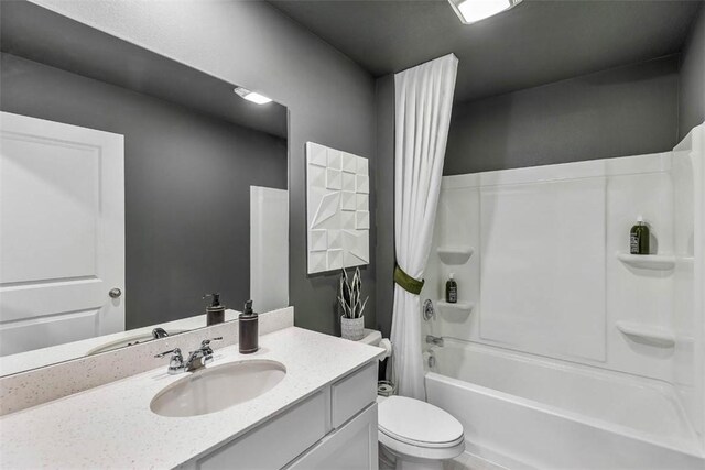 full bathroom with toilet, shower / bathtub combination with curtain, and vanity