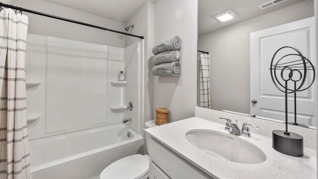 full bathroom featuring toilet, shower / bath combination with curtain, and vanity