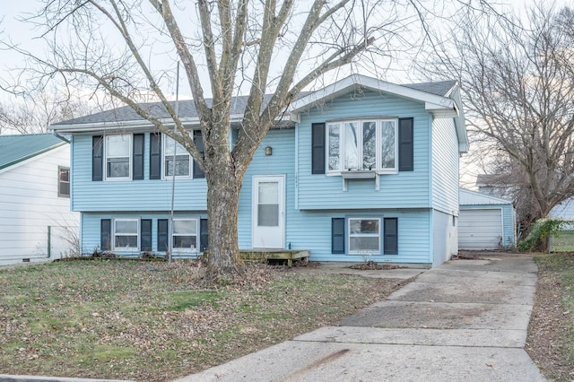 split foyer home with an outbuilding and a garage