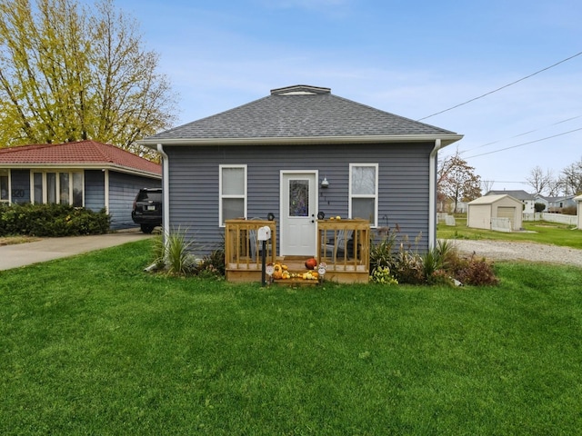 back of property featuring a lawn