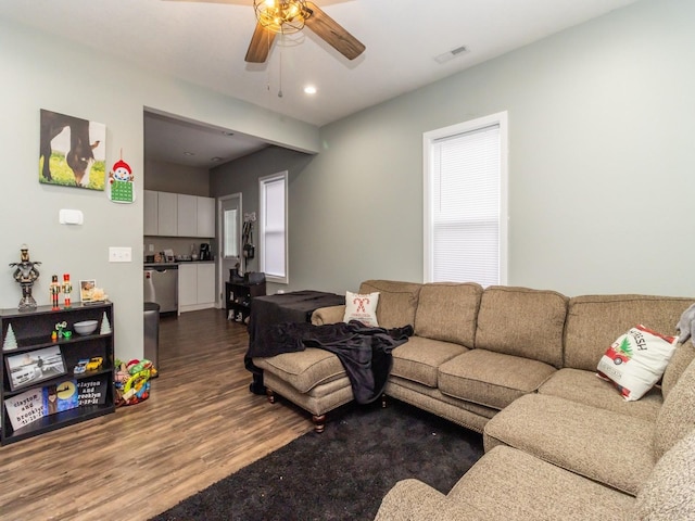 living room with hardwood / wood-style flooring and ceiling fan