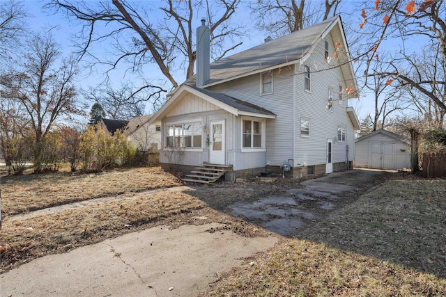 view of side of property featuring a storage shed