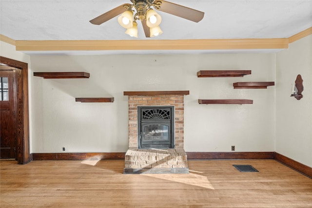 unfurnished living room featuring a brick fireplace, light hardwood / wood-style flooring, and ceiling fan