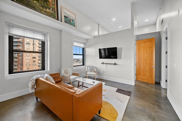 living room with a towering ceiling