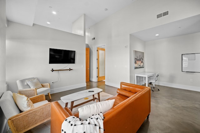 living room with a high ceiling