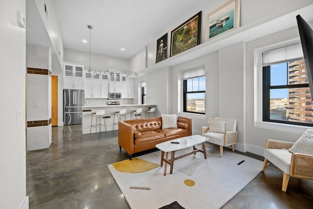 living room with a high ceiling