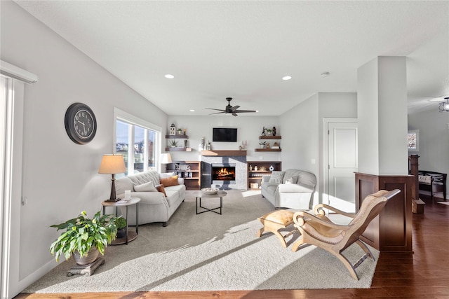 living room featuring ceiling fan and dark wood-type flooring