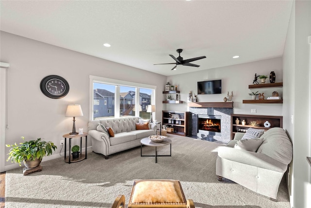 living room featuring carpet floors and ceiling fan