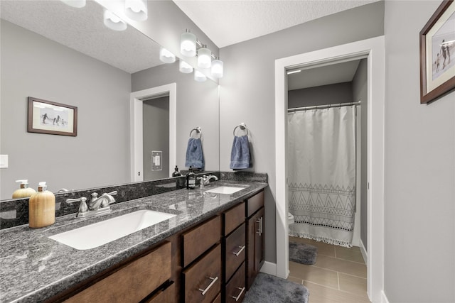 bathroom with vanity and a textured ceiling