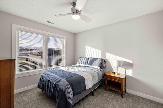 carpeted bedroom with ceiling fan