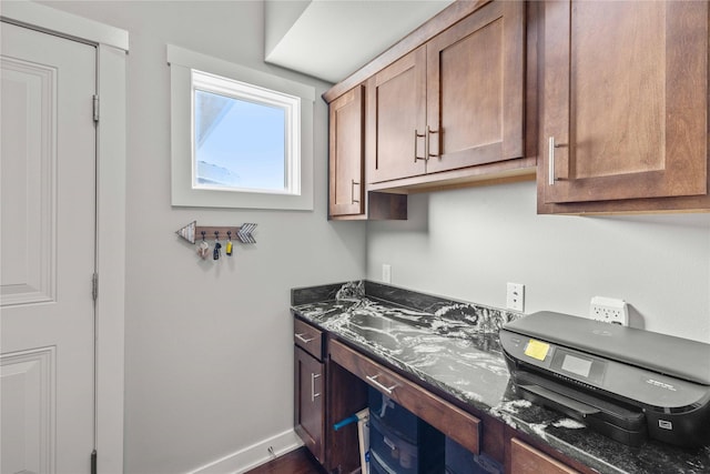 kitchen featuring dark stone counters