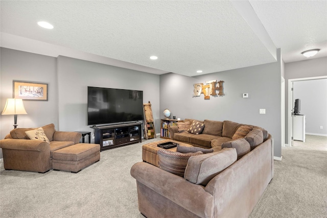 living room with light colored carpet and a textured ceiling