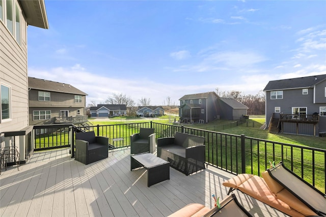 deck featuring a lawn and an outdoor hangout area