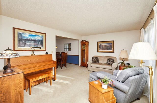 living room with light colored carpet and a textured ceiling