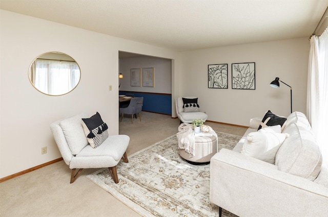 living room with carpet flooring and baseboards