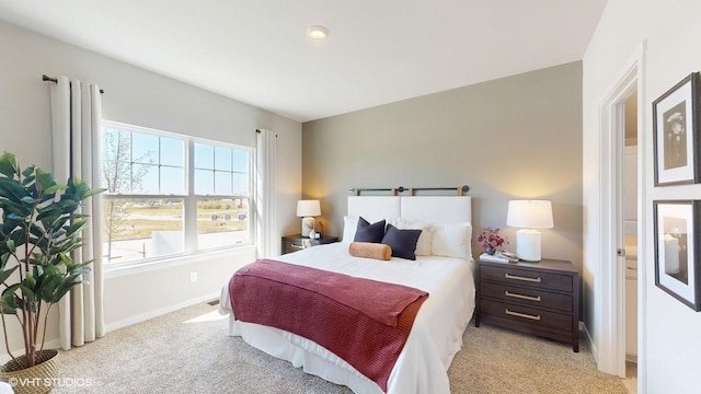 bedroom featuring light colored carpet