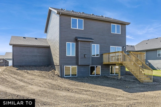 rear view of property with a deck