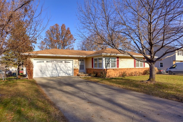 ranch-style house with a garage and a front yard