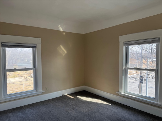 carpeted empty room featuring a healthy amount of sunlight