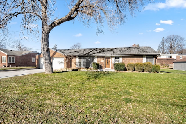 ranch-style home featuring a garage and a front lawn