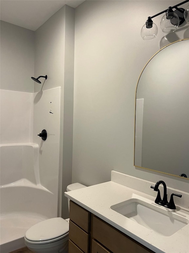 203 Hudson Ave, Van Meter, IA 50261 - full bath featuring vanity, toilet, and a shower