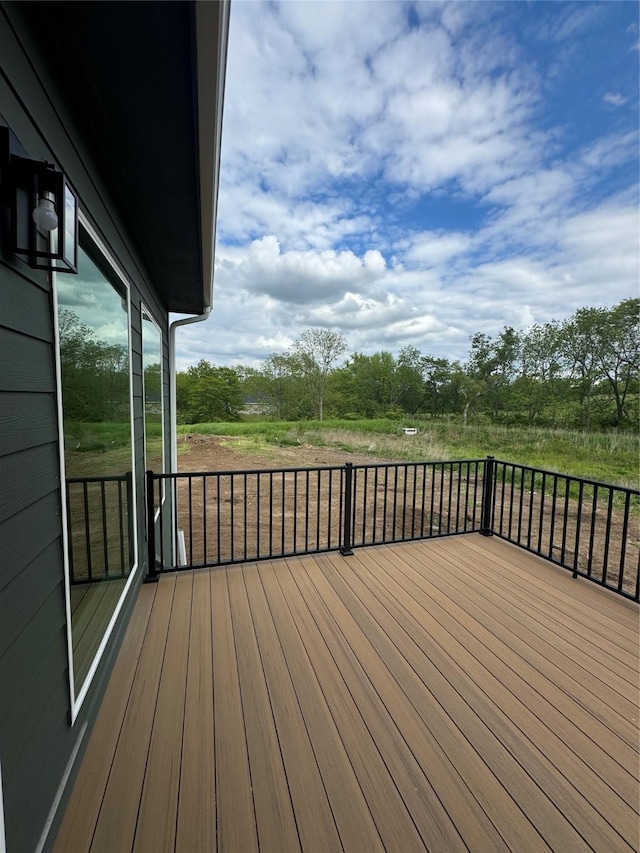 203 Hudson Ave, Van Meter, IA 50261 - wooden deck with view of wooded area